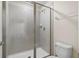 Clean bathroom with a tiled shower and neutral color scheme at 164 Holly Village Dr, Davenport, FL 33837