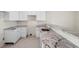 Modern kitchen with white cabinets and granite countertops at 164 Holly Village Dr, Davenport, FL 33837