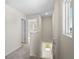 Upstairs hallway with neutral carpeting and a window at 164 Holly Village Dr, Davenport, FL 33837
