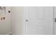 Bright laundry room with utility hookups and built-in shelving at 164 Holly Village Dr, Davenport, FL 33837