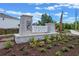 Preston Cove community entrance with modern stonework signage at 404 Preston Cove Dr, Saint Cloud, FL 34771