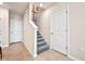 Modern staircase with carpeted steps and neutral wall colors at 404 Preston Cove Dr, Saint Cloud, FL 34771