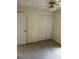 Well-lit bedroom with ceiling fan and double-door closet at 2421 Omaha Dr, Deltona, FL 32738