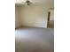 Bright and airy bedroom with ceiling fan and carpeting at 2421 Omaha Dr, Deltona, FL 32738