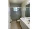 Bathroom with a shower, toilet, and white vanity at 2421 Omaha Dr, Deltona, FL 32738