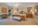 King-size bed, large windows and neutral decor in this well-lit bedroom at 1900 W Fawsett Rd, Winter Park, FL 32789