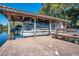 Covered boat lift on a spacious wooden dock at 1900 W Fawsett Rd, Winter Park, FL 32789