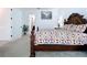 Bright bedroom featuring a comfortable bed and en-suite bathroom access at 128 Hampton Loop, Davenport, FL 33837