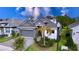 Two story house with gray exterior and paver driveway at 128 Hampton Loop, Davenport, FL 33837