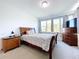 Bright bedroom with a double bed and large windows at 128 Hampton Loop, Davenport, FL 33837