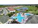 Community pool, tennis courts, and golf course views at 128 Hampton Loop, Davenport, FL 33837