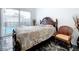 Bedroom with king-size bed, pool access, and sitting chair at 128 Hampton Loop, Davenport, FL 33837