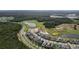 Aerial view of houses and a golf course at 128 Hampton Loop, Davenport, FL 33837