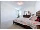 Comfortable bedroom with a king-size bed and dresser at 128 Hampton Loop, Davenport, FL 33837