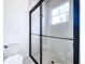 Clean bathroom with a walk-in shower and patterned tile at 128 Hampton Loop, Davenport, FL 33837