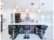 Modern kitchen with large island, stainless steel appliances, and white cabinets at 128 Hampton Loop, Davenport, FL 33837