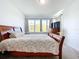 Spacious bedroom featuring a large window and wood dresser at 128 Hampton Loop, Davenport, FL 33837