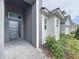 Modern home exterior with gray accents and landscaping at 128 Hampton Loop, Davenport, FL 33837