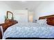 Well-lit bedroom with a comfortable bed and built-in wardrobe at 128 Hampton Loop, Davenport, FL 33837