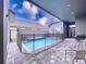 Private, screened pool with patio furniture at 128 Hampton Loop, Davenport, FL 33837