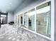 Covered patio with glass doors leading to the interior at 128 Hampton Loop, Davenport, FL 33837