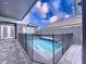 Private backyard pool with safety fence at 128 Hampton Loop, Davenport, FL 33837
