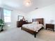 Modern bedroom with a king-size bed and stylish nightstands at 128 Hampton Loop, Davenport, FL 33837