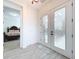 Bright entryway with view of bedroom and access to backyard pool at 128 Hampton Loop, Davenport, FL 33837