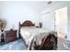 Guest bedroom with dark wood furniture and marble floors at 128 Hampton Loop, Davenport, FL 33837