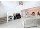 Two story living room with open floor plan, TV, and staircase at 128 Hampton Loop, Davenport, FL 33837