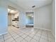 Dining area with kitchen access and view to living room at 250 Lewfield Cir, Winter Park, FL 32792