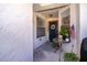 Inviting entryway with a decorative wreath and potted plants at 211 Hill St, Casselberry, FL 32707