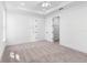 Serene bedroom with carpet flooring, an attached bath, and walk-in closet at 4190 Rossmore Dr, Orlando, FL 32810