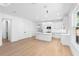 Open concept kitchen with white cabinets and an island at 4190 Rossmore Dr, Orlando, FL 32810