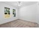 Bright bedroom with neutral walls, carpet and two windows at 4190 Rossmore Dr, Orlando, FL 32810