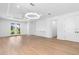 Spacious living area with hardwood floors and French doors at 4190 Rossmore Dr, Orlando, FL 32810