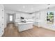 Open concept kitchen with island and white cabinets at 4190 Rossmore Dr, Orlando, FL 32810