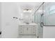 Elegant bathroom featuring a single vanity, quartz countertop, and a frameless glass shower at 4190 Rossmore Dr, Orlando, FL 32810