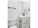 Clean bathroom with white vanity, black fixtures and large mirror at 4190 Rossmore Dr, Orlando, FL 32810