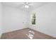 Spacious bedroom with neutral walls, ceiling fan and window at 4190 Rossmore Dr, Orlando, FL 32810
