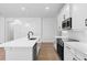 Modern white kitchen with stainless steel appliances and an island at 4190 Rossmore Dr, Orlando, FL 32810