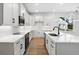 Modern white kitchen with stainless steel appliances and an island at 4190 Rossmore Dr, Orlando, FL 32810