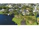 Aerial view showcasing lakefront property at 4190 Rossmore Dr, Orlando, FL 32810