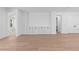 Open living space with hardwood floors and access to bedroom at 4190 Rossmore Dr, Orlando, FL 32810