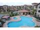 Community pool and spa, perfect for relaxation and recreation at 914 Charo Pkwy # 114, Davenport, FL 33897