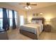 Spacious bedroom with a comfortable bed and access to balcony at 914 Charo Pkwy # 114, Davenport, FL 33897