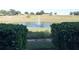 Serene pond with fountain, offering a tranquil outdoor setting at 914 Charo Pkwy # 114, Davenport, FL 33897