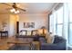 Bright living room with comfy sofas, large windows, and a coffee table at 914 Charo Pkwy # 114, Davenport, FL 33897