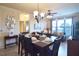 Dining room with a table for six and a view into the living room at 914 Charo Pkwy # 114, Davenport, FL 33897