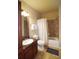 Clean bathroom with tub, shower, granite vanity, and tiled floor at 914 Charo Pkwy # 114, Davenport, FL 33897